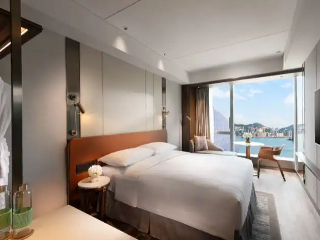 Stylish modern hotel room at Dorsett Kai Tak, Hong Kong with Victoria Harbour view